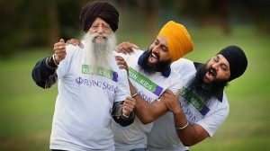 101-year-old Fauja Singh, pictured with Gurtej Singh and Gurvinder Singh, will be taking part in Herald Sun-CityLink Run for the Kids