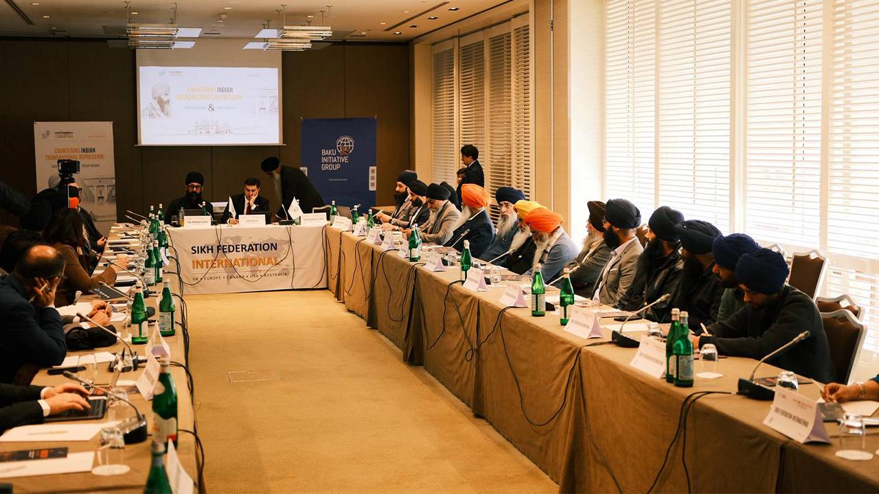 Representatives of Sikh Federation International and Baku Initiative Group attend a discussion meeting during a conference in Geneva on transnational repression.