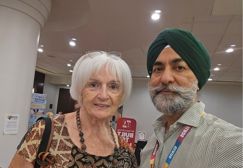 Kavneet Singh with an attendee.