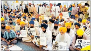 6 june 1 sikh sangat Sikh activists of various Panthic bodies holding portraits of Sikh Martyrs in front of Sri Akal Takht
