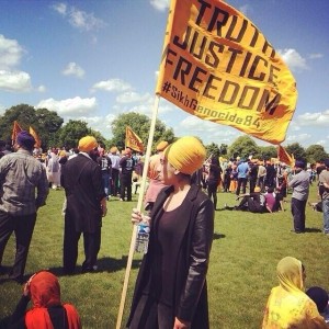 A Sikh woman hold flag during 8 June gathering in London