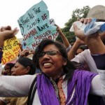 A demonstrator shouts slogans out side a court in New Delhi