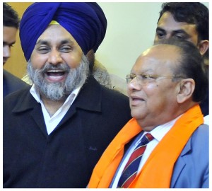 Joginderpal Jain (R) with Sukhbir Badal [File Photo]