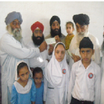 Satnam Singh's family receiving a cheque
